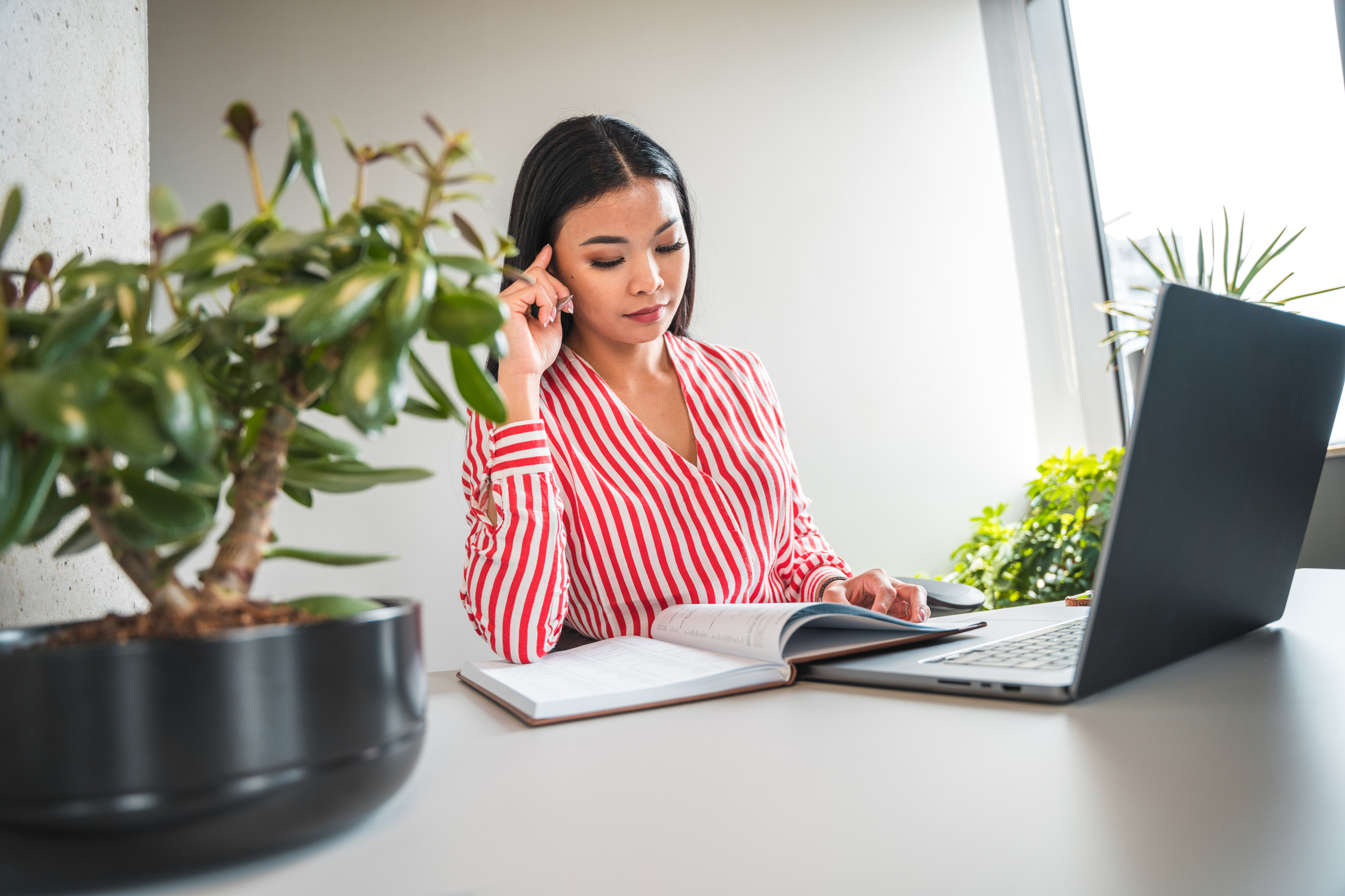 Smart Young Asian Female Virtual Assistant Working